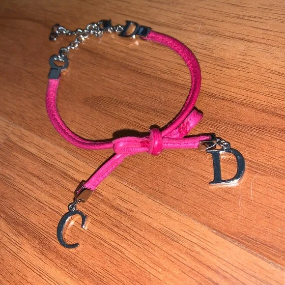 Authentic Christian Dior Leather and Metal Charm Bow Bracelet